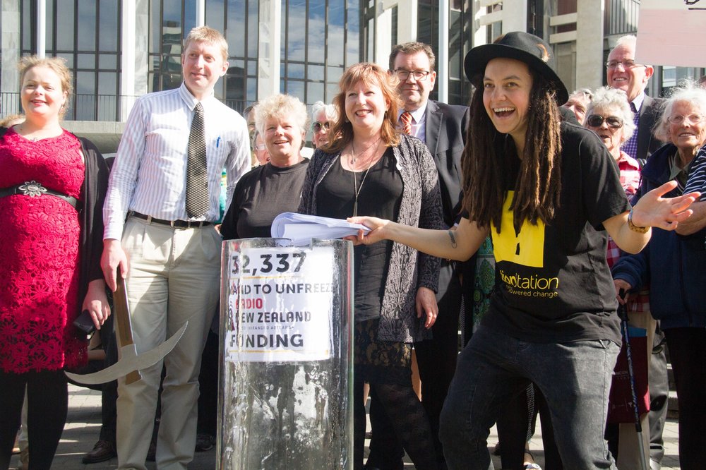 Laura delivering our RNZ petition in a giant block of ice
